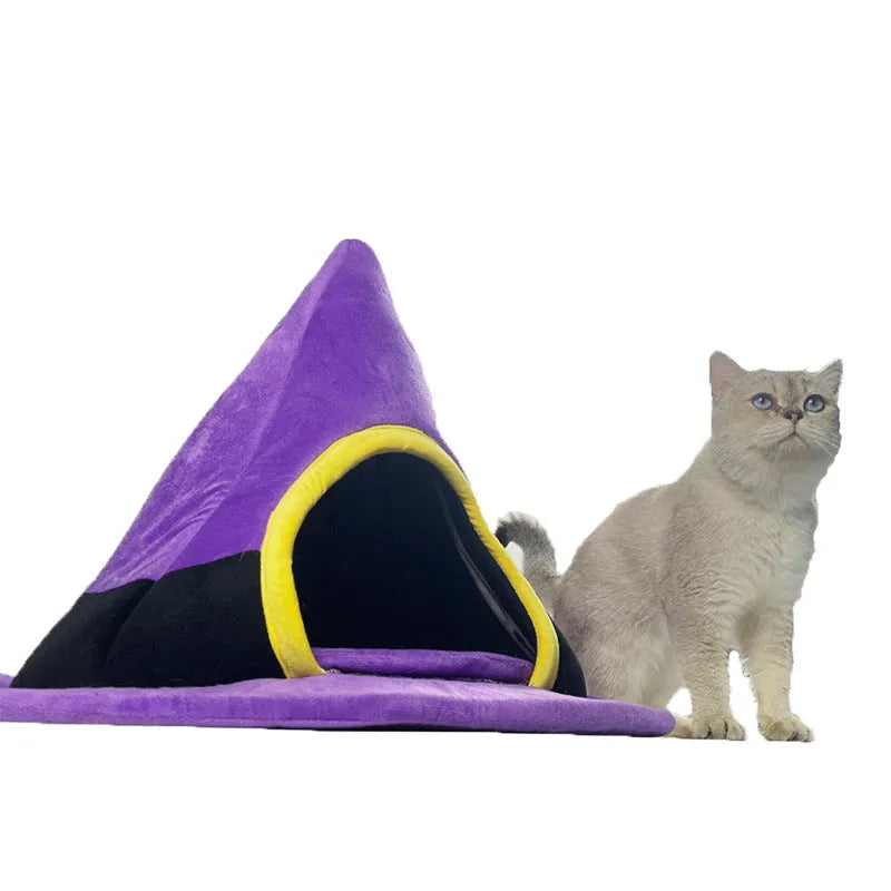 Purple cloth Halloween witch hat shaped cat bed measuring 60 by 45 centimetres
