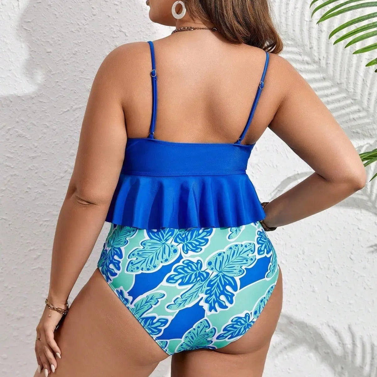 Blue polyester bikini swimsuit set with top and shorts on a mannequin