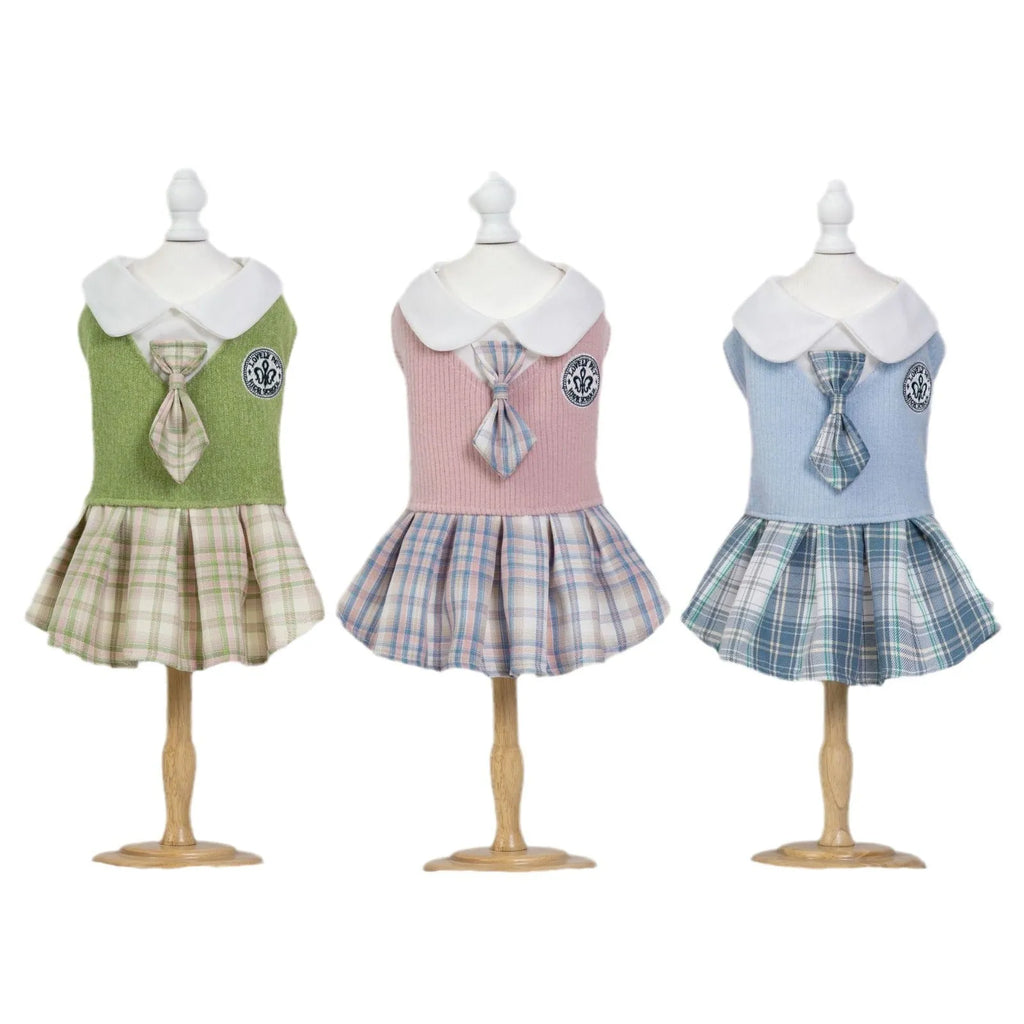 A pink tartan skirt for a small dog, showing the elastic waistband and princess-style flare.