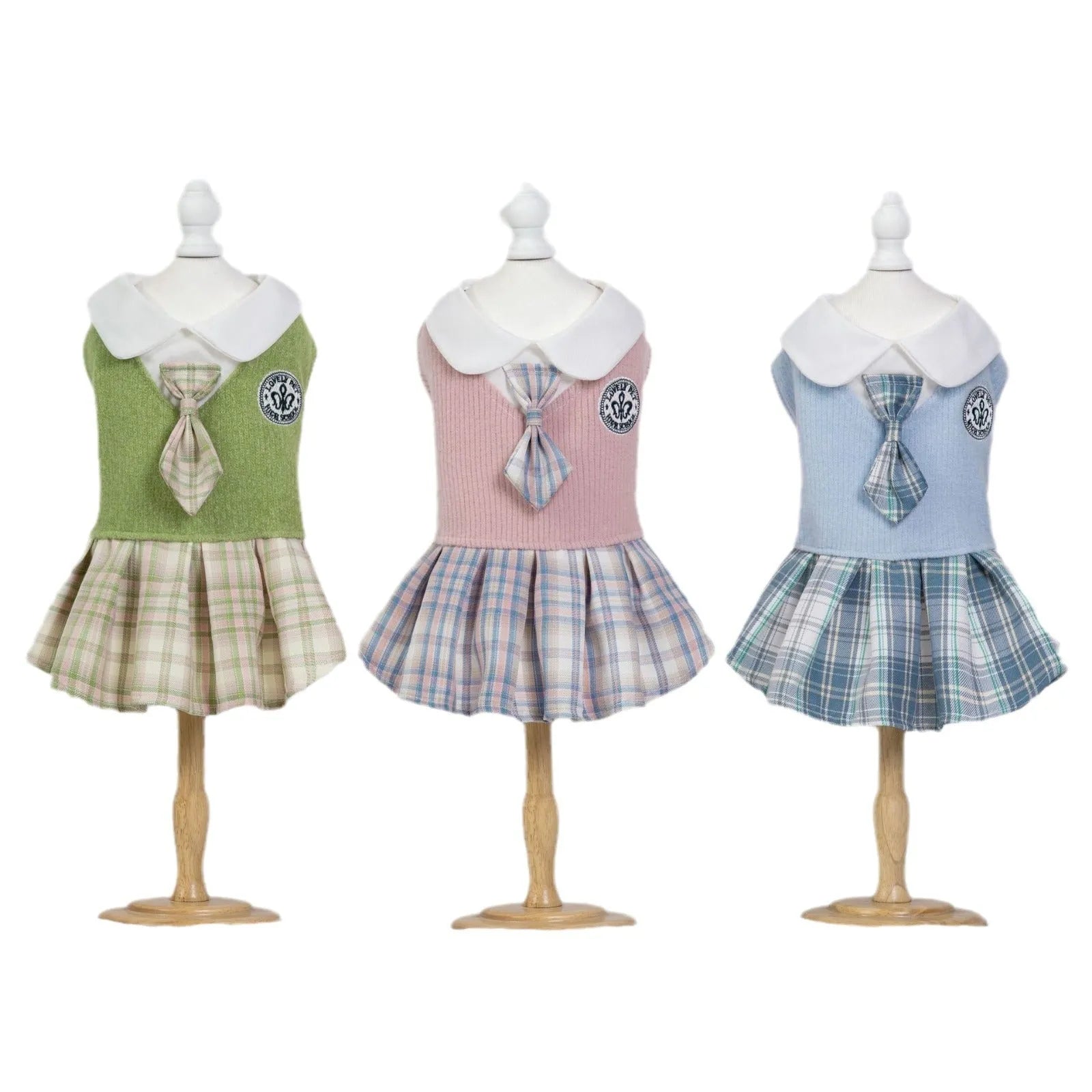 A pink tartan skirt for a small dog, showing the elastic waistband and princess-style flare.