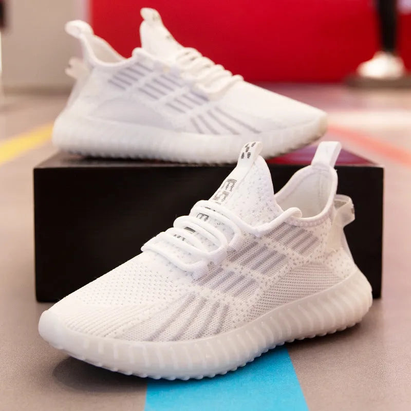 Men's white breathable fabric sports shoes with low-cut design and flat platform heel.