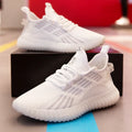 Men's white breathable fabric sports shoes with low-cut design and flat platform heel.