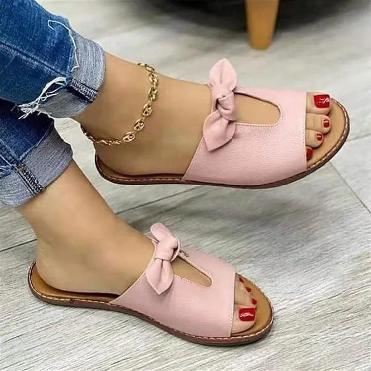 Ladies casual sandals with bow detail and fish mouth style in black, pink or gold