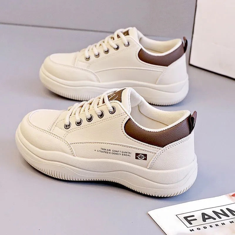 Women's white Korean-style leather pumps with cross straps and a flat mid-height heel.