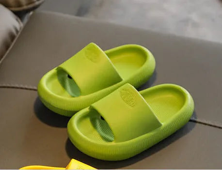 Children's brightly coloured EVA slippers with a thick, non-slip sole.