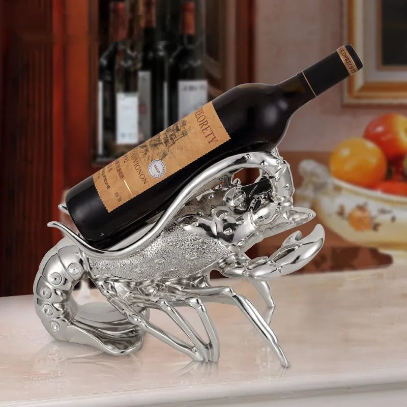 Lobster-shaped wine rack ornament in rose gold or silver, holding a single bottle.