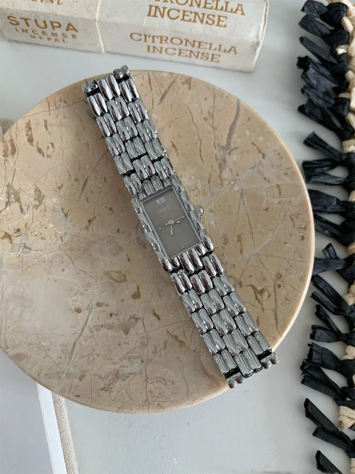Women's bracelet-style watch with 15mm dial, mineral glass, and butterfly buckle in silver or gold finishes