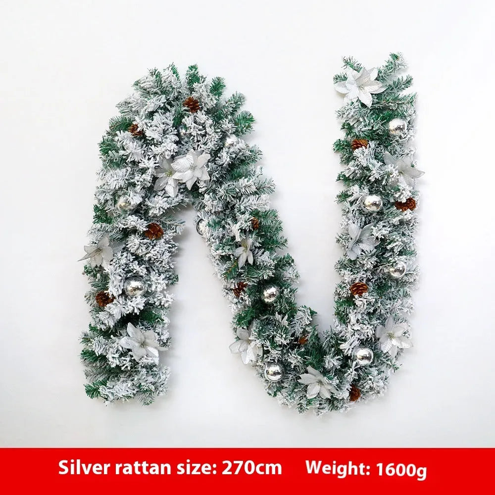 PVC Christmas rattan garland with flocking in golden colour, draped decoratively.