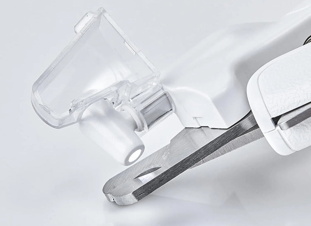 White pet nail clippers with LED light, transparent anti-splash baffle, and triangular steel blades for cats and dogs