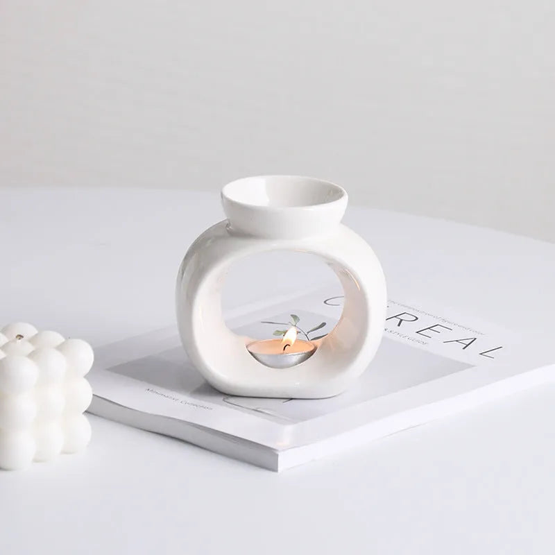 White ceramic Nordic style aromatherapy stove ornament measuring 10cm diameter