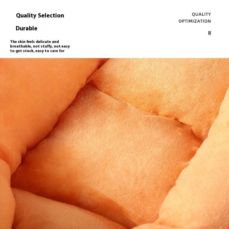 Carrot-shaped orange dog bed with removable washable cover on a floor