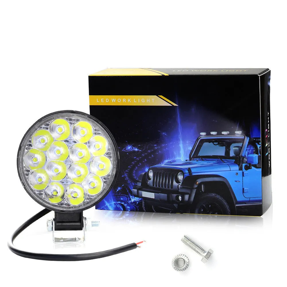Mini round aluminium LED work light with white light, 42W power and IP67 waterproof rating.