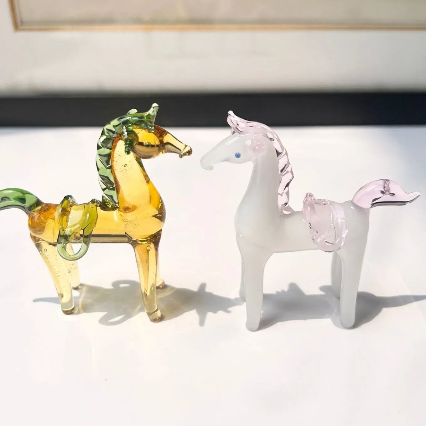 Coloured glaze horse sculpture in brown finish on wooden desk