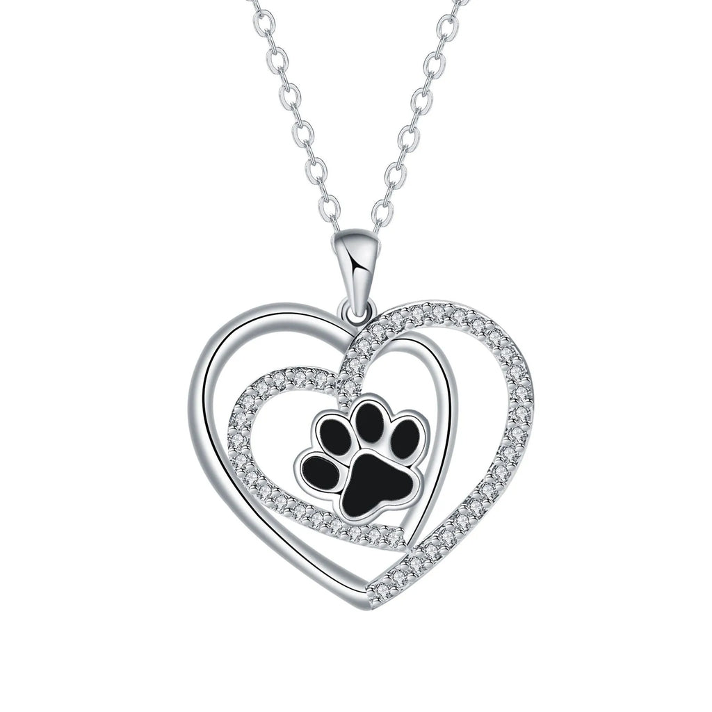 Women's copper necklace with dog paw print pendant and heart charm on cross chain