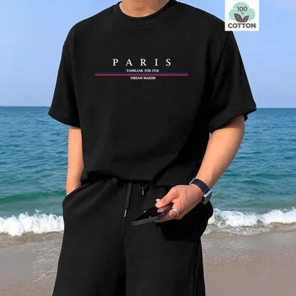 Man wearing a heavy loose-fit pure cotton T-shirt with a letter print on the chest in a casual setting.