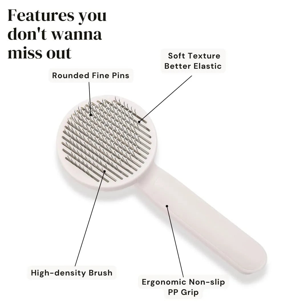Blue self-cleaning pet grooming brush with stainless steel pins and ergonomic rubber handle