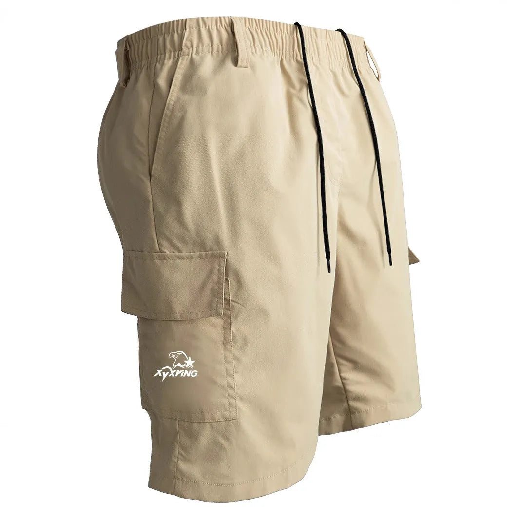 Man wearing loose straight-leg casual shorts in polyester, shown in khaki colour, demonstrating the American sporty style fit.