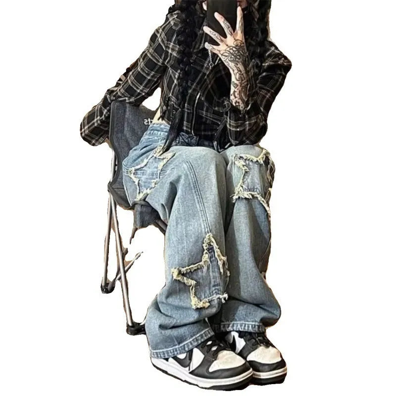 Blue high-waisted wide-leg denim jeans on a hanger showing straight-leg cut.