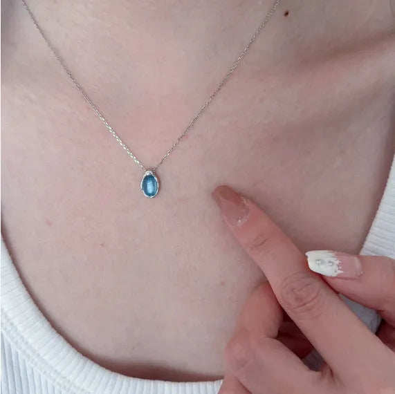 Women's navy blue water drop necklace with geometric pendant on adjustable copper chain