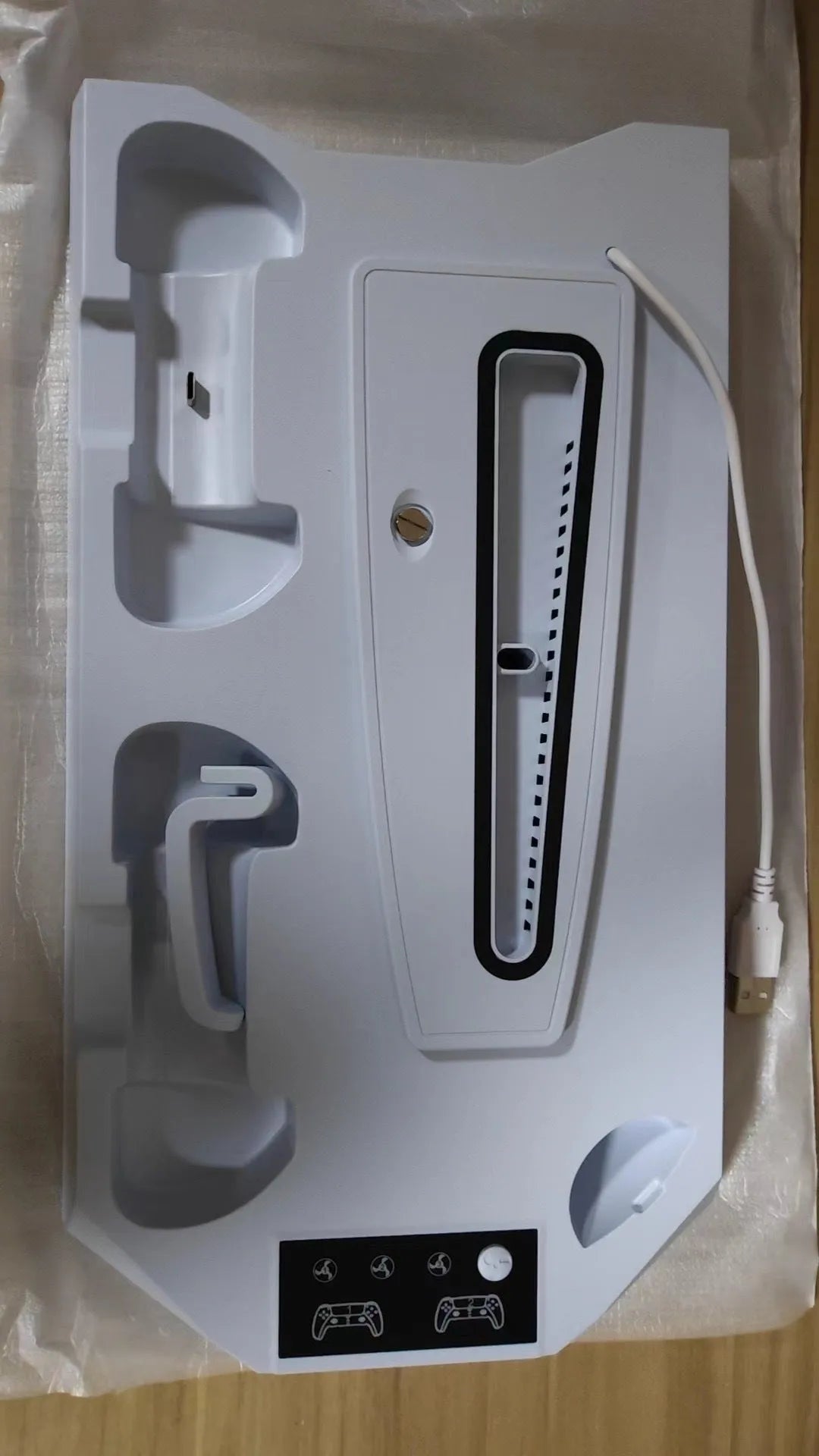 PS5 charging base radiator in white with two controller charging ports and cooling function