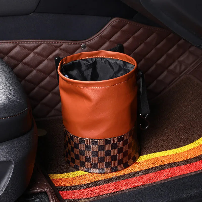 Black retractable leather car trash can with carry handle, shown folded and expanded