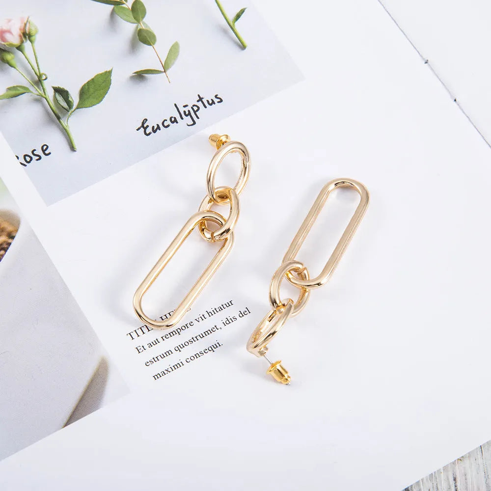 Sterling silver needle geometric hoop earrings with ring and line design elements