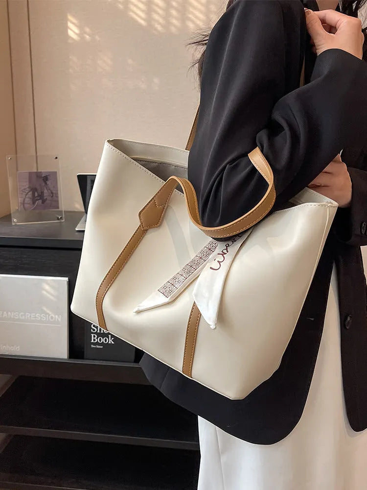 Large capacity bucket tote bag with soft construction and sandwich pocket design