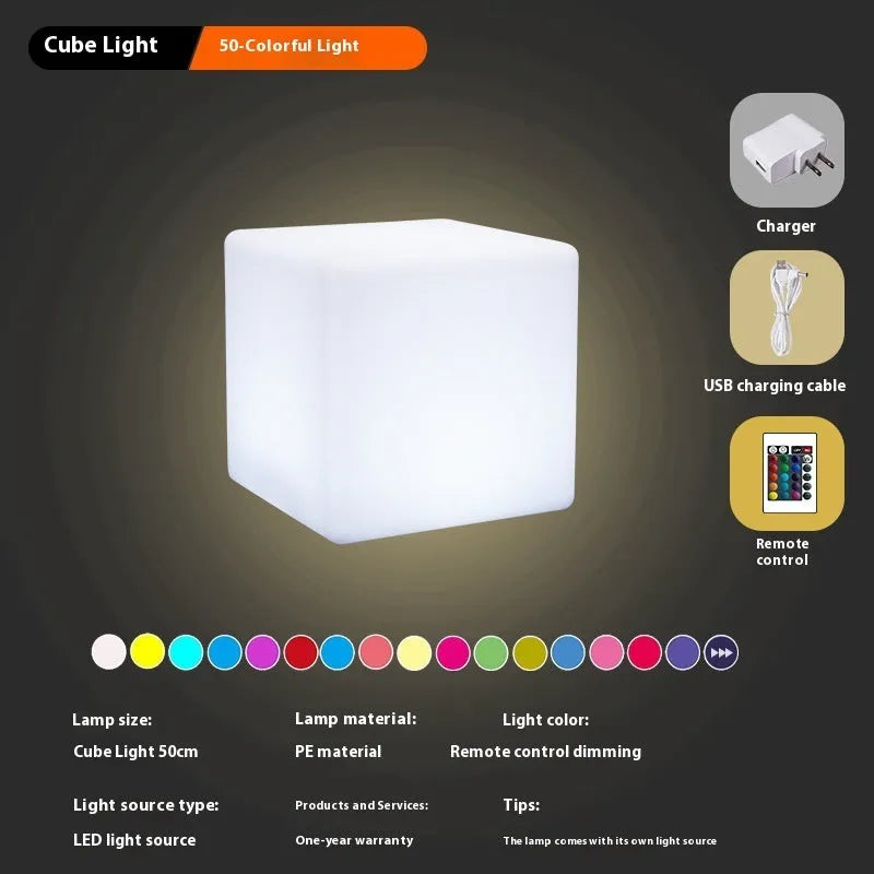White square LED cube stool light for outdoor use, showing modern design with solar panel or charging port.