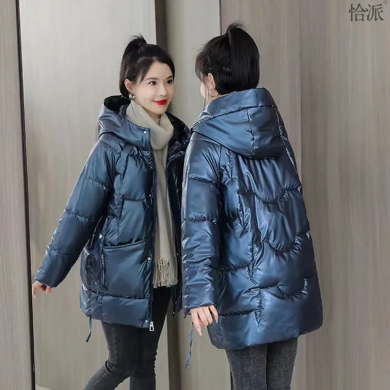 Women's loose fit thick hooded down cotton jacket in black, shown with long sleeves and a front zip.