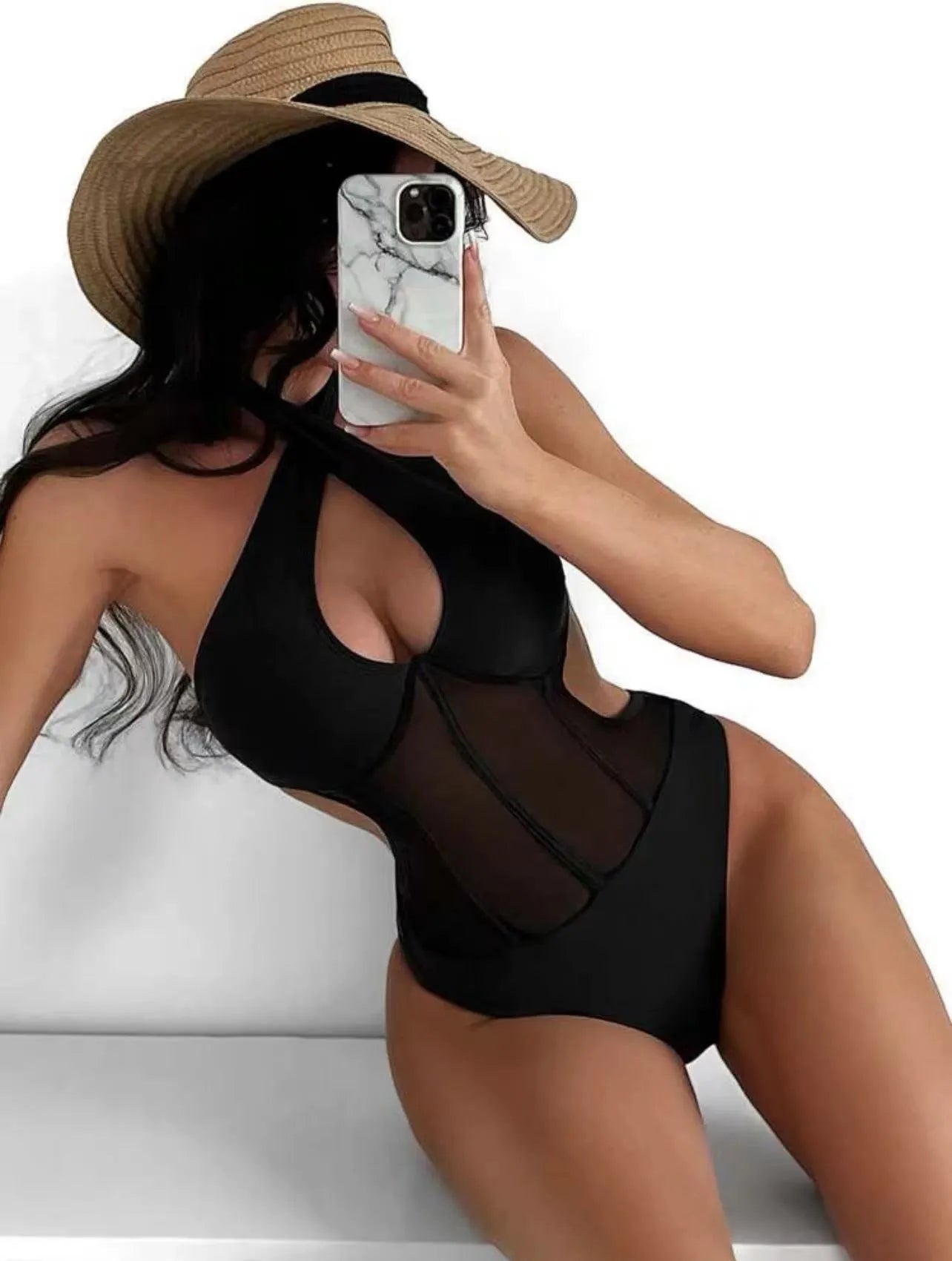 A woman's one-piece swimsuit bikini in a nylon and spandex blend, shown in black, rose red, and green colour options.