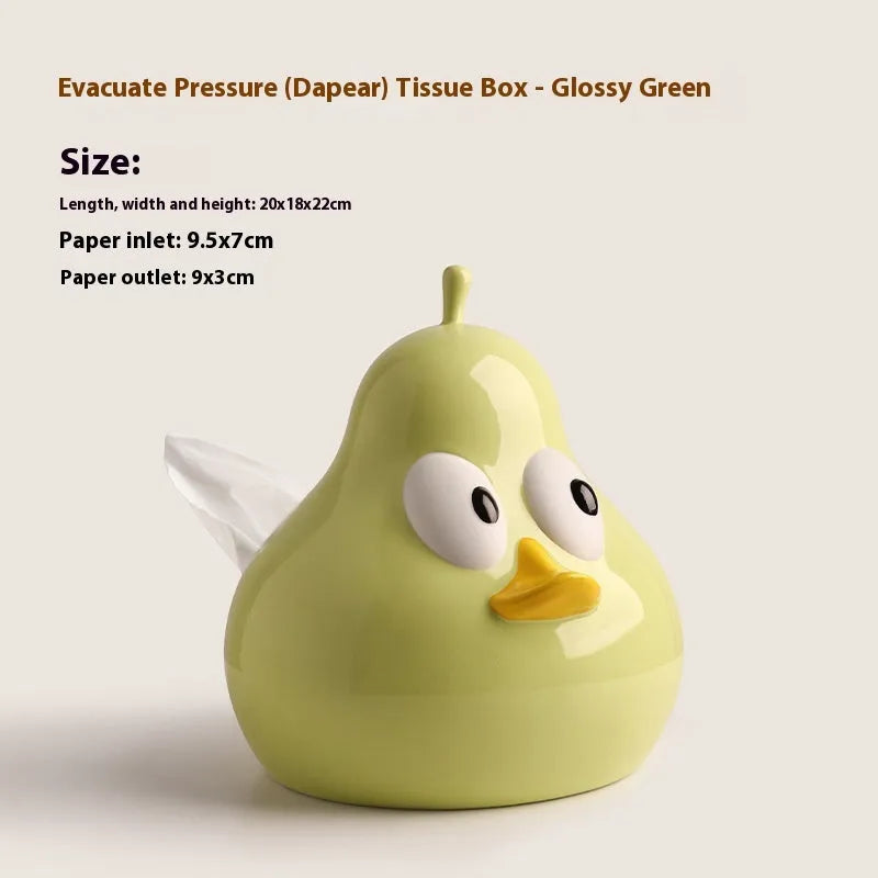 White ceramic pear-shaped tissue box in green or black colour on desktop