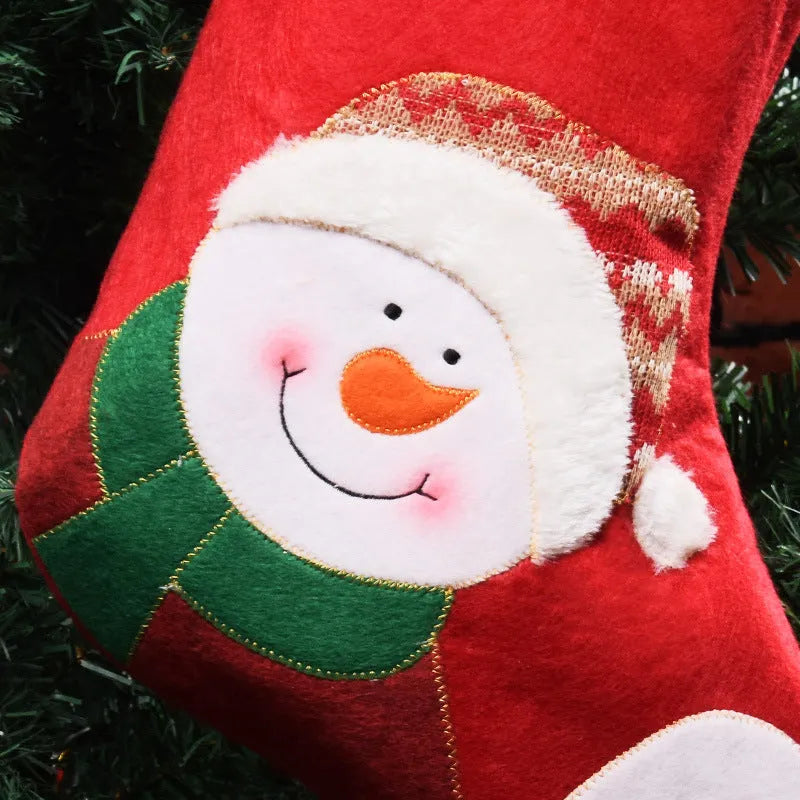Non-woven fabric Christmas stocking ornament with elk, elderly man, and snowman folk art designs.