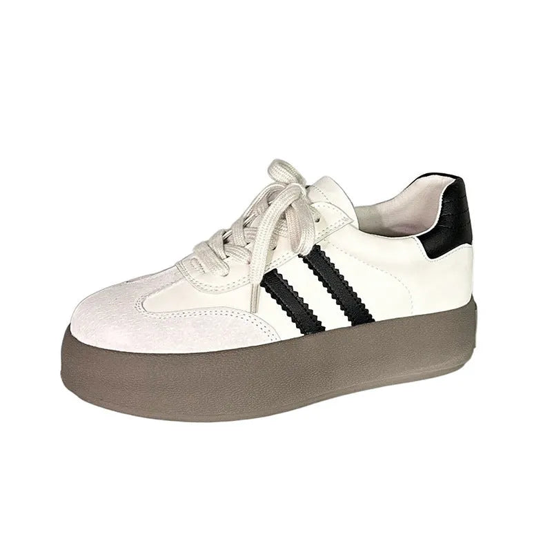 Women's beige distressed leather vintage lace-up sneakers with round toe and rubber sole on a white background.