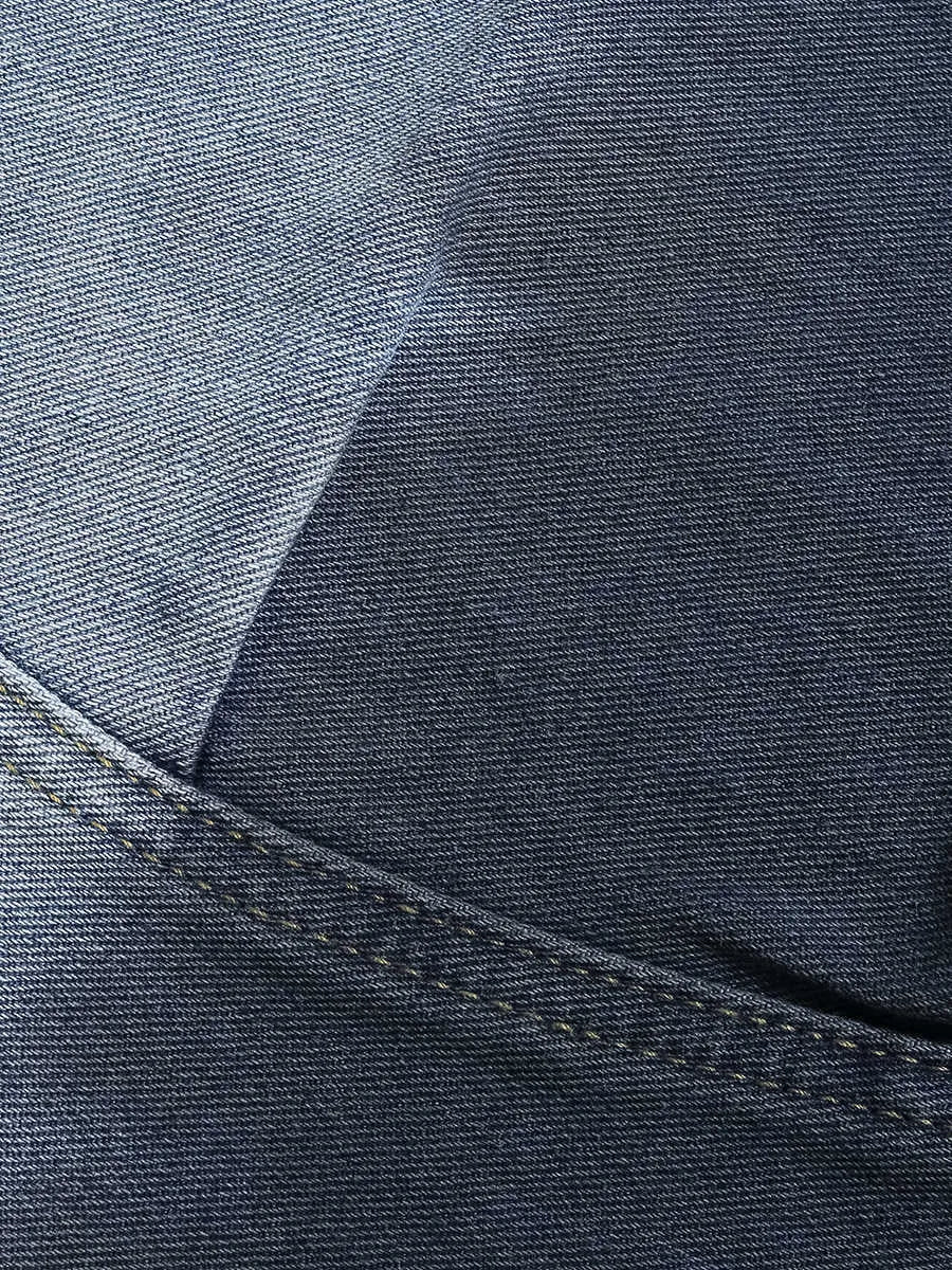 Blue tie-dye gradient cropped jeans with a worn-looking finish and loose, relaxed fit.