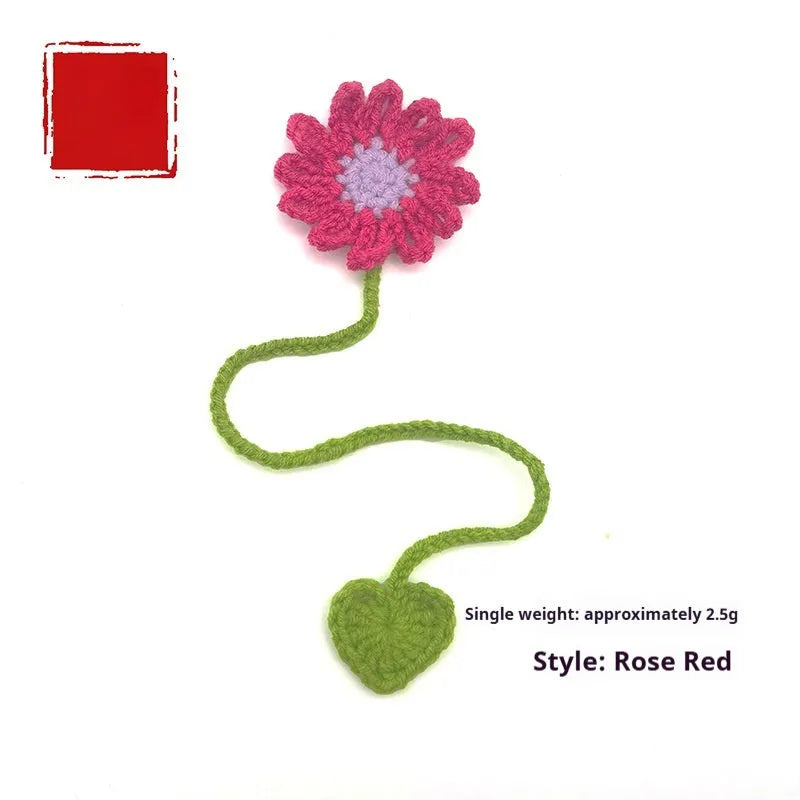 Hand-crocheted daisy flexible wire bookmark in yellow, pink, light purple, and orange colours.