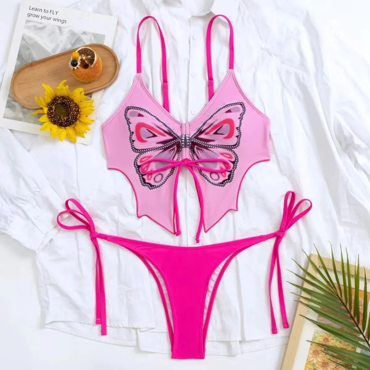 Women's purple bikini with bow ins style back detailing and briefs bottoms