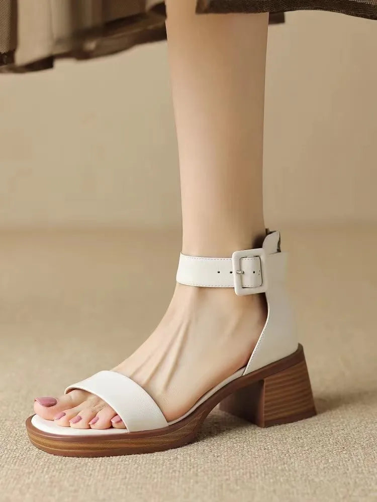 White women's retro platform high heels with an ankle strap and round toe.