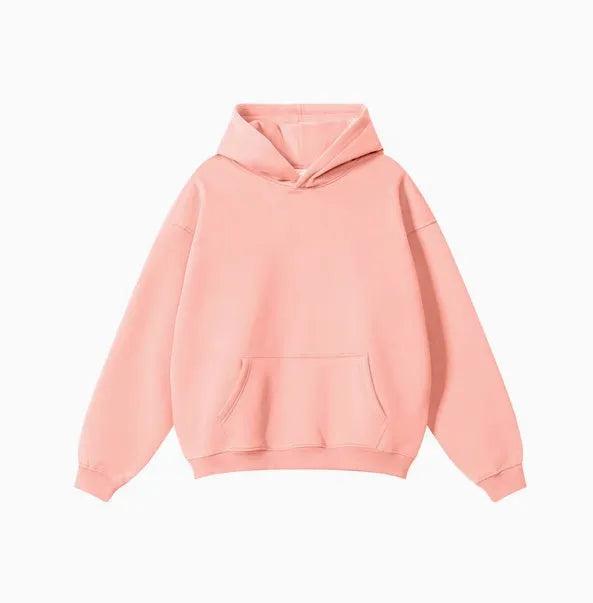 Man wearing a loose-fit cotton terry hooded sweater with drop-shoulder sleeves in a solid colour.