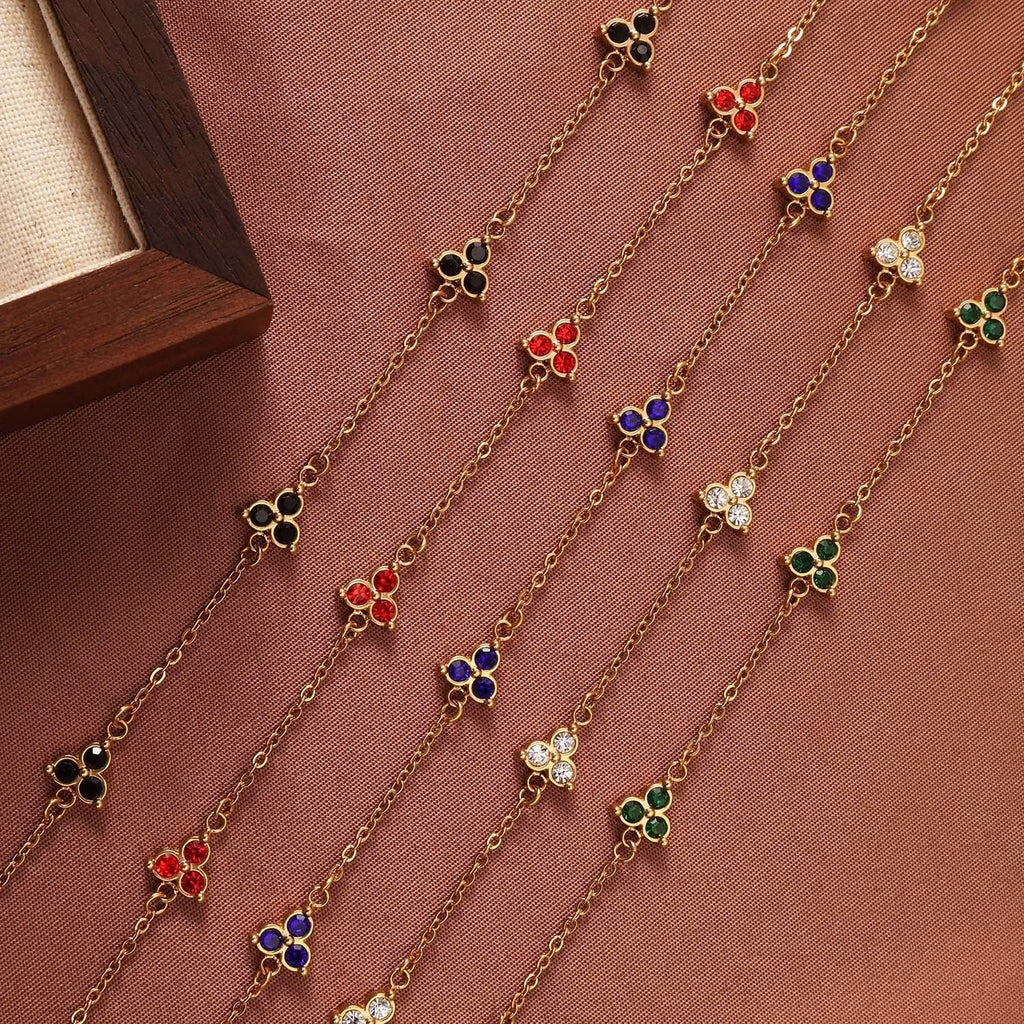 Stainless steel women's bracelet with three triangular diamond motifs set with colourful zircon stones.