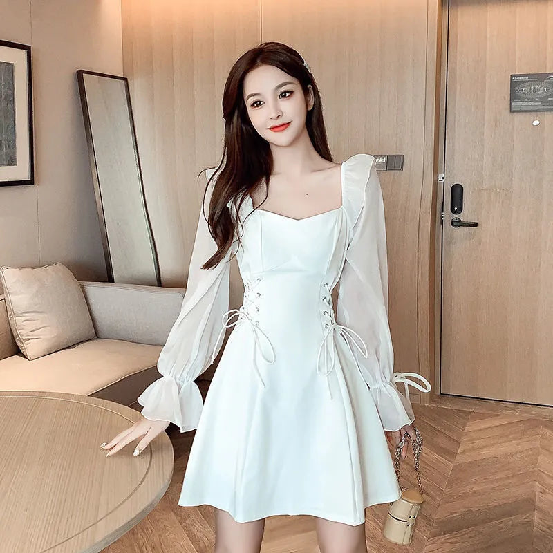 White chiffon patchwork waist-slimming dress with long sleeves and maxi skirt length on mannequin