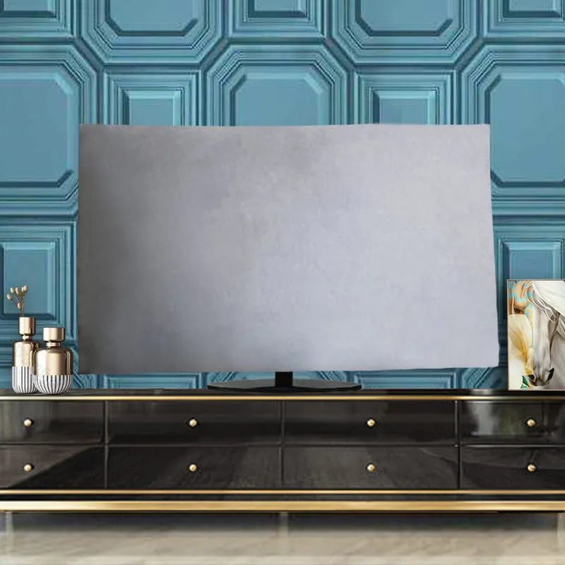 A pink velvet television cover draped over a flat-screen TV, showing its elasticated hem and soft fabric texture.