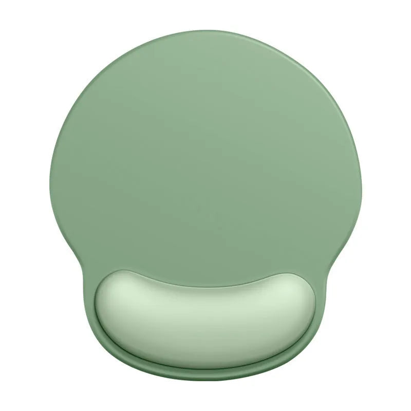Silicone mouse mat with wrist rest in gradient colour pattern on desk