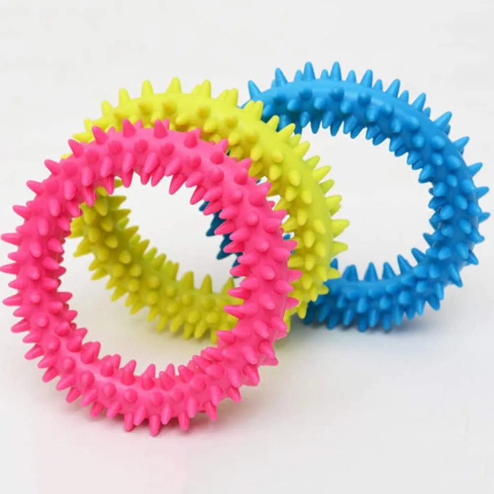 Blue TPR spiky circle dog chew toy for dental cleaning on a white background.