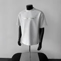 Men's loose fit cotton t-shirt with a printed letters pattern in light grey