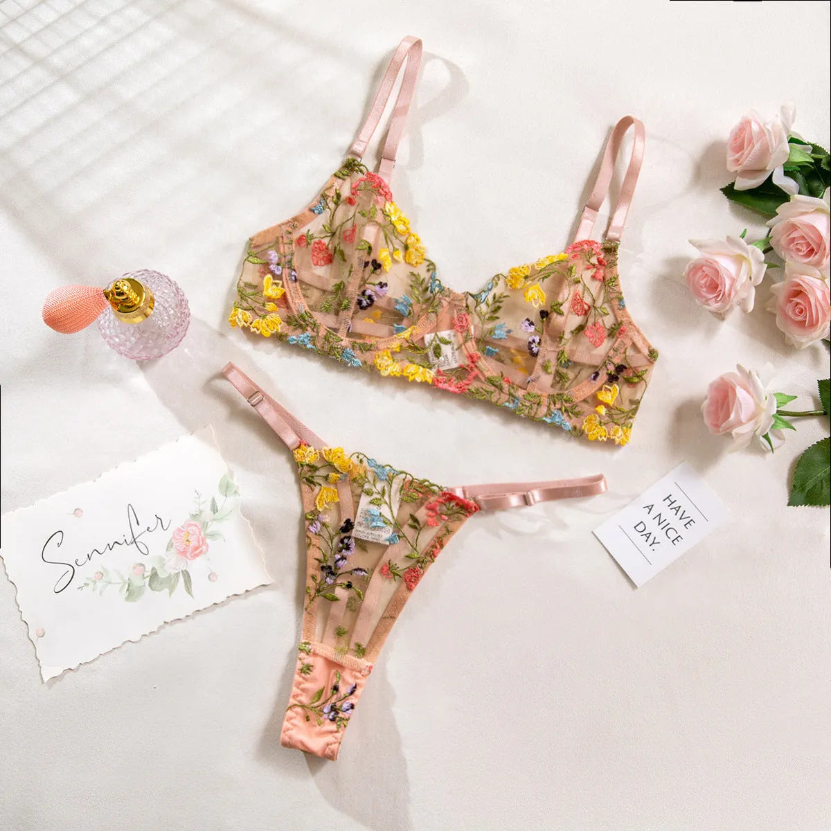 Women's floral underwear set in pure desire style showing five colour options including skin tone, purple, black, yellow and pink