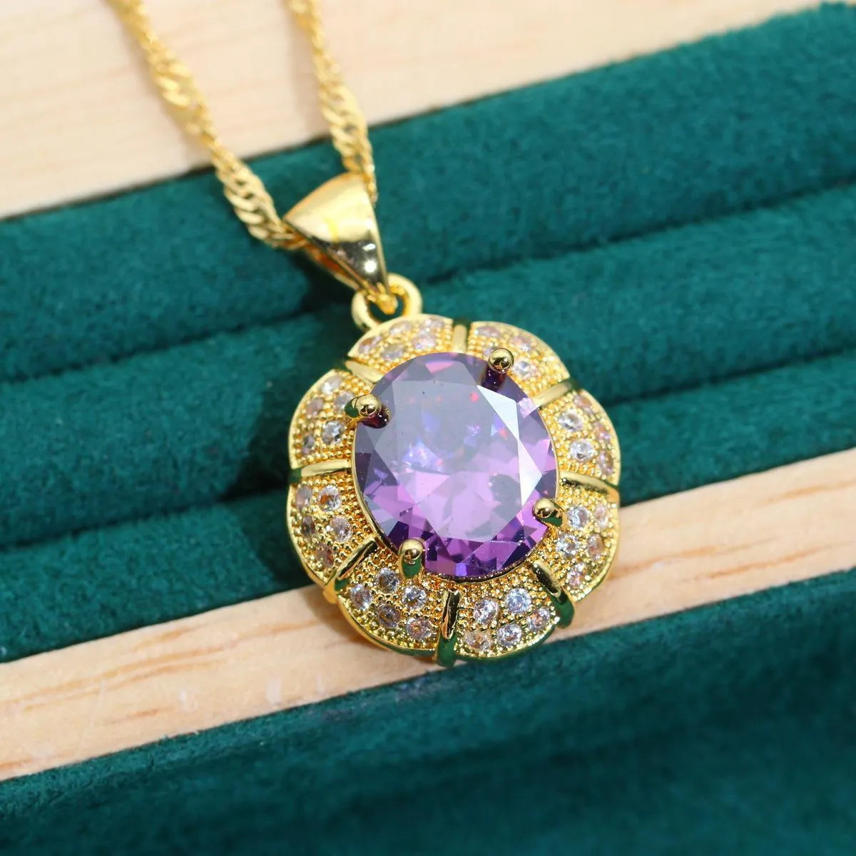 18k gold plated zircon jewellery set showing necklace, earrings, ring, and bracelet with synthetic cubic zirconia stones