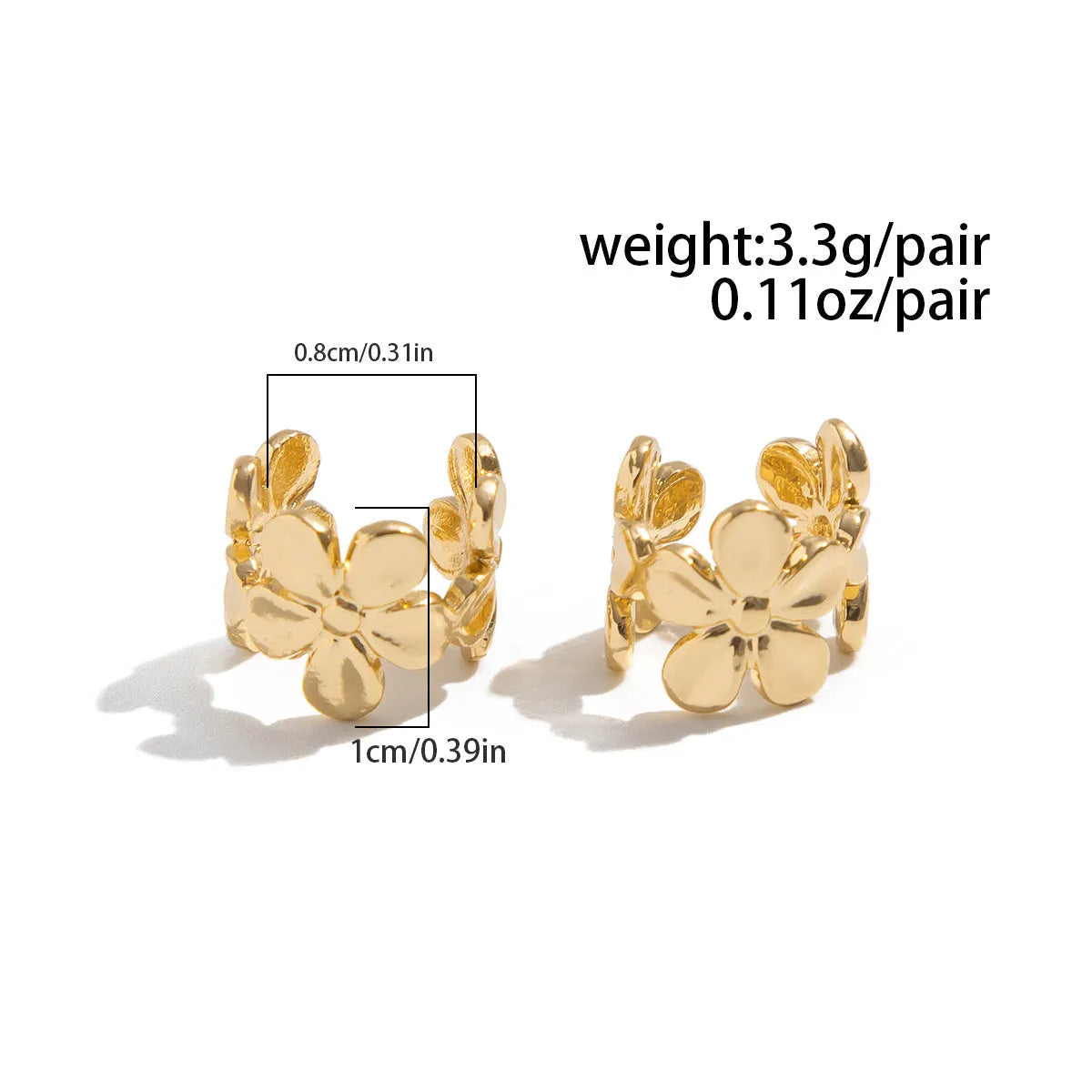 Gold-coloured women's earrings with conch and starfish beach-themed decorative elements