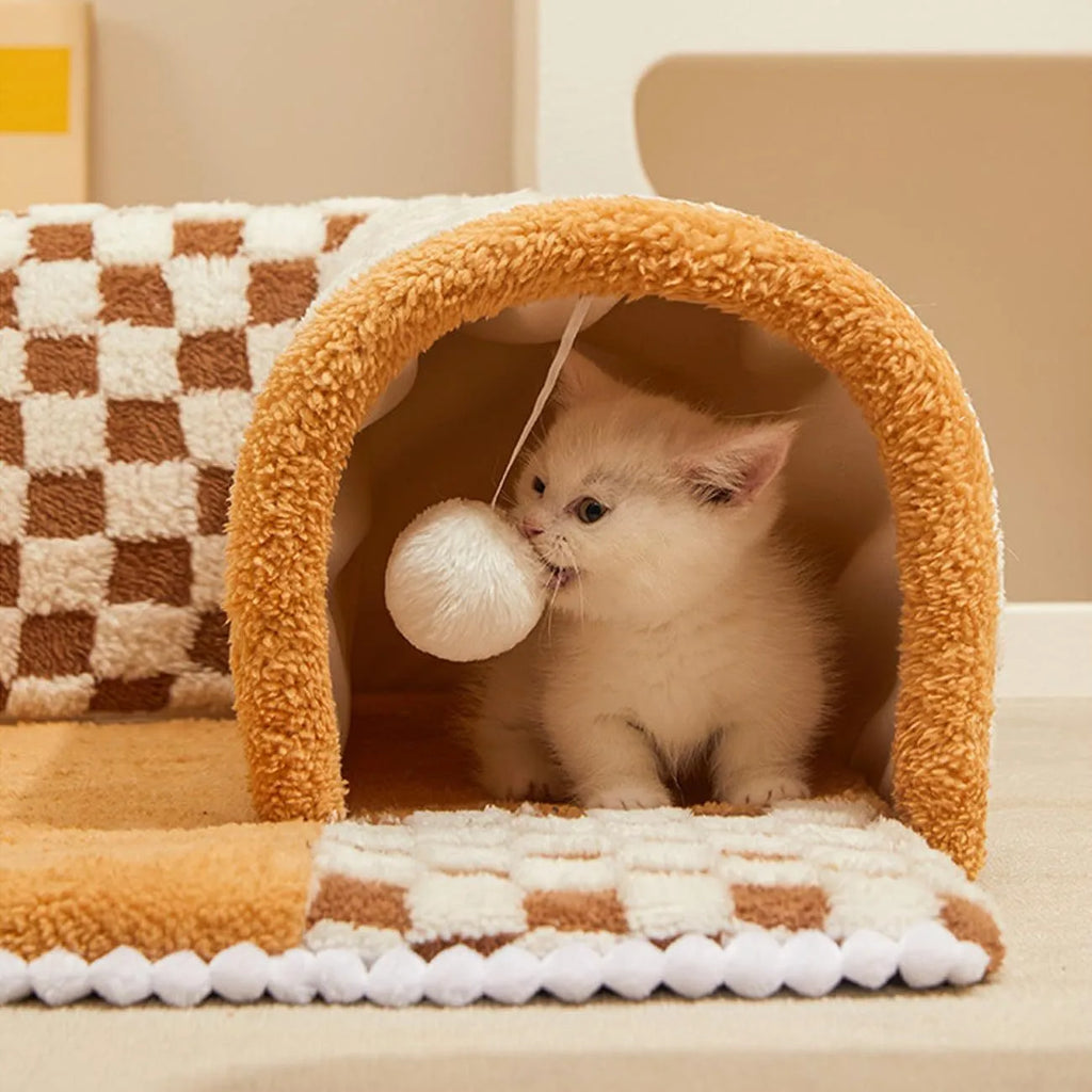 Fan-shaped plush pet bed with integrated tunnel for cats and small dogs in a plaid pattern.