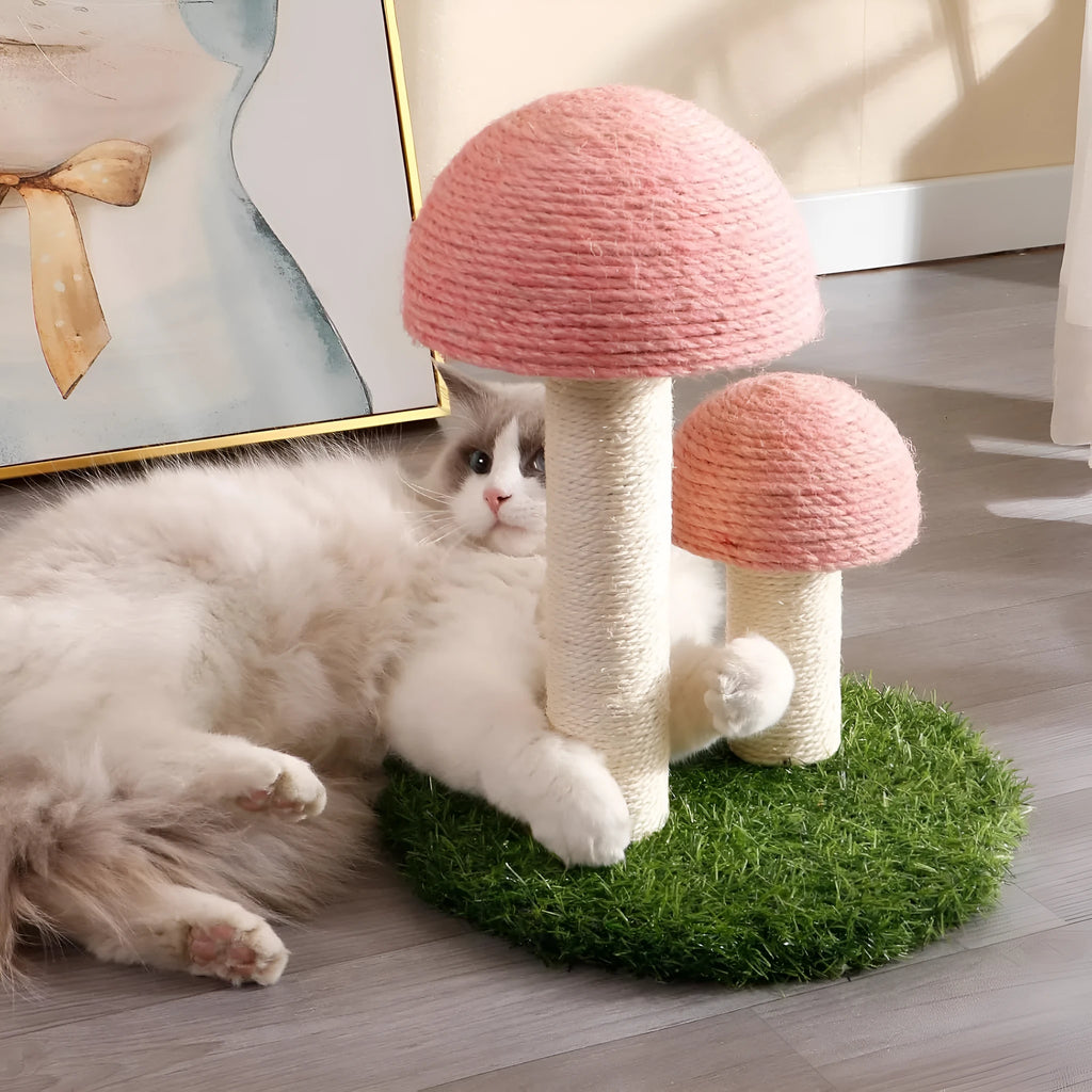 Pink mushroom-shaped cat scratching post with natural sisal fabric on mushroom cap and pole