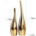 Pair of Nordic gold plating ceramic vases in modern curved bottle shape for home decor